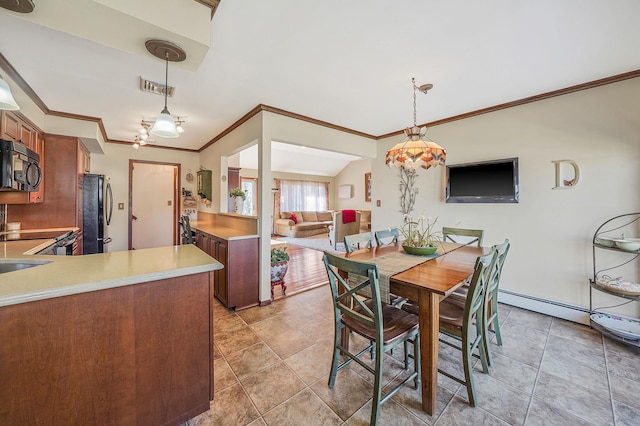 dining space with light tile patterned floors, visible vents, baseboard heating, and ornamental molding