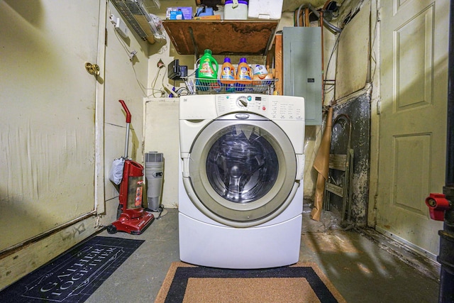 clothes washing area featuring washer / dryer, electric panel, and laundry area