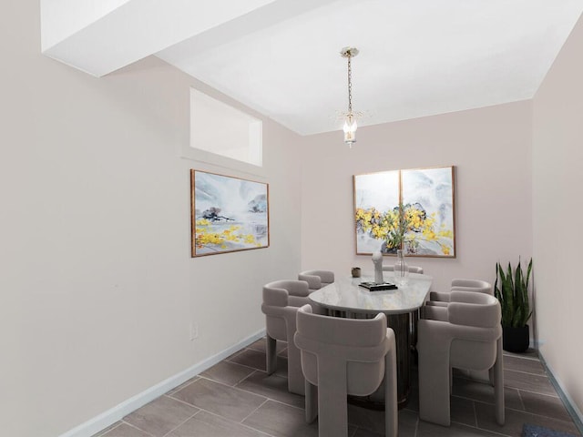 dining area with tile patterned floors and baseboards