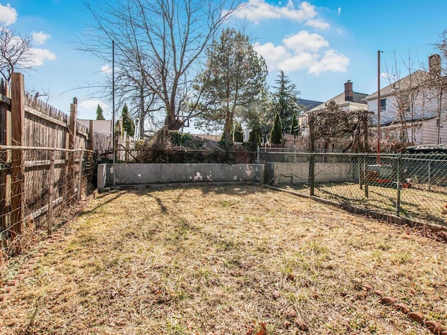 view of yard with a fenced backyard