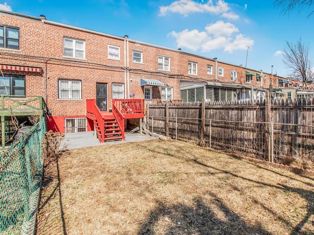 exterior space featuring a patio area and a fenced backyard