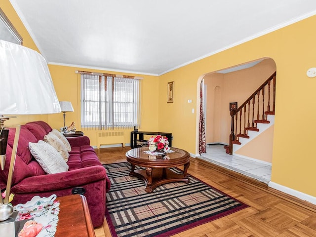 living room featuring crown molding, radiator, and arched walkways