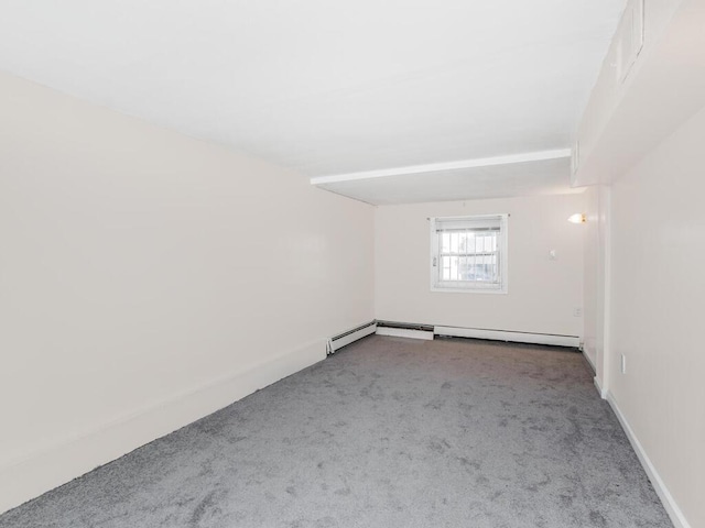 unfurnished room featuring carpet and baseboards