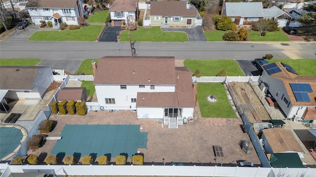 birds eye view of property with a residential view