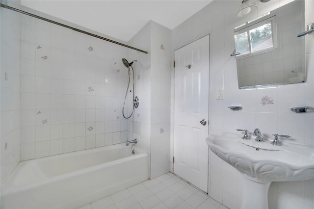 bathroom with bathtub / shower combination, tile walls, tile patterned flooring, and decorative backsplash