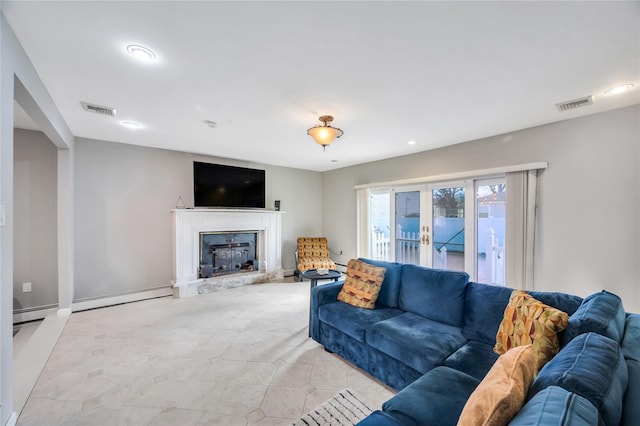 living room featuring visible vents, french doors, a fireplace, and a baseboard radiator