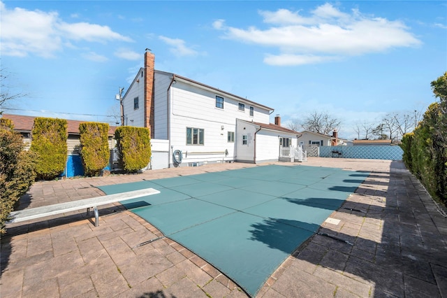 view of swimming pool with a fenced in pool, a patio area, and fence