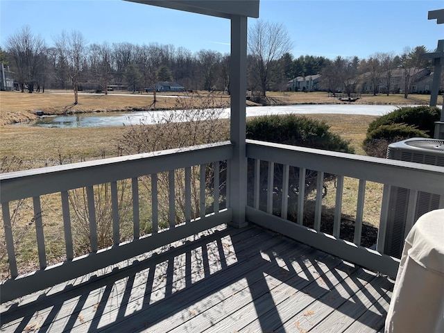 wooden deck with a water view and central AC