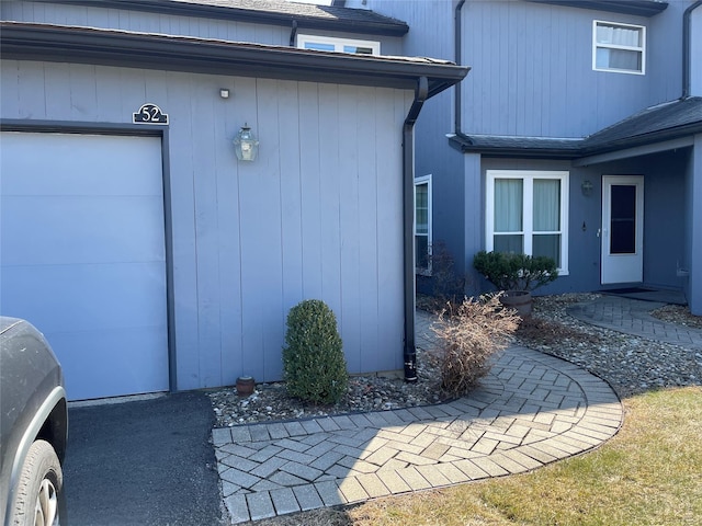 property entrance with an attached garage