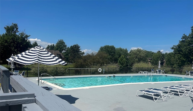 pool featuring a patio and fence