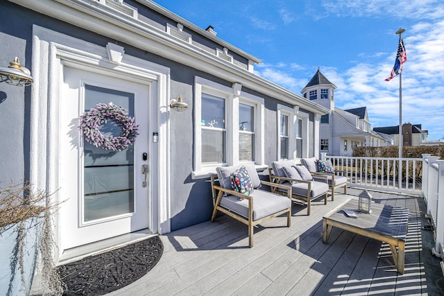 wooden deck featuring an outdoor living space