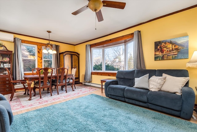 living room featuring crown molding, a wall unit AC, baseboard heating, ceiling fan with notable chandelier, and wood finished floors