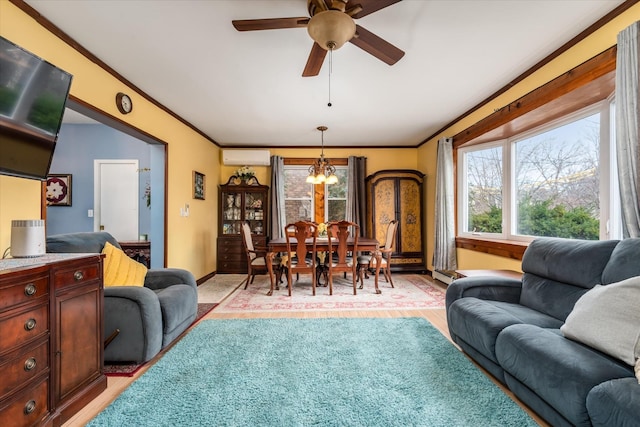 living room with baseboards, ornamental molding, a wall mounted air conditioner, a baseboard heating unit, and ceiling fan with notable chandelier