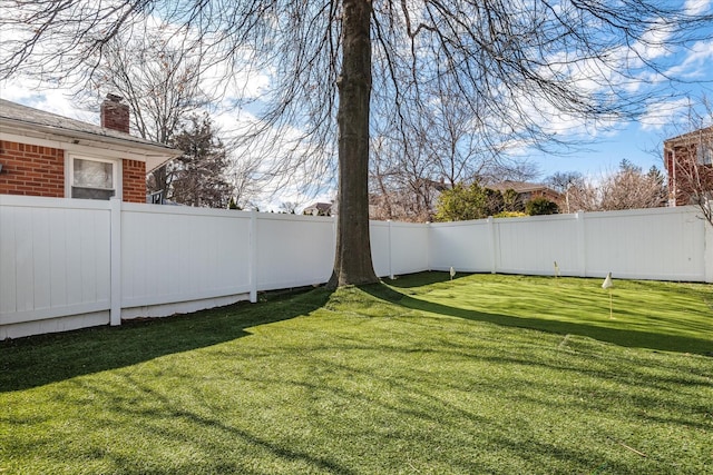 view of yard featuring a fenced backyard