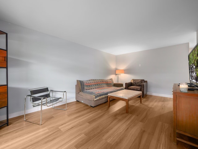 living room with wood finished floors and baseboards