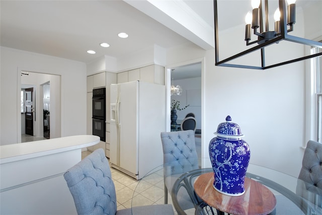 dining space with crown molding, light tile patterned floors, recessed lighting, and a chandelier