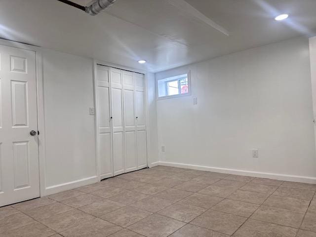 unfurnished bedroom featuring recessed lighting, a closet, and baseboards