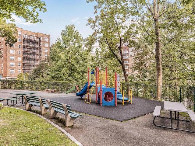 communal playground featuring fence