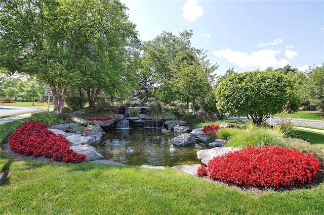 25 Fairways Dr Unit 1, Middletown, NY 10940 - view of community with a garden pond and a yard