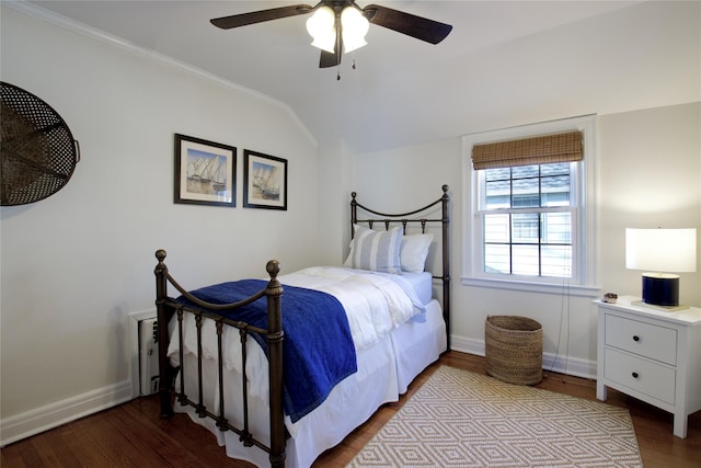 bedroom with vaulted ceiling, a ceiling fan, baseboards, and wood finished floors