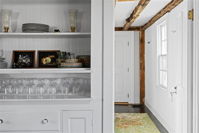interior details featuring baseboards and wood finished floors