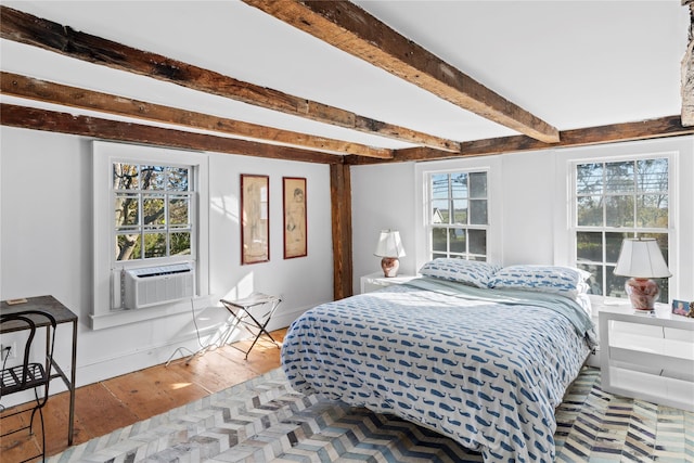 bedroom featuring beamed ceiling, cooling unit, wood finished floors, and baseboards