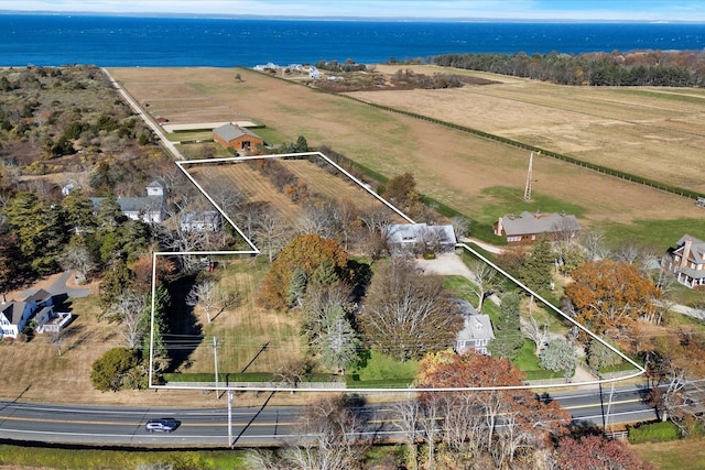 drone / aerial view featuring a rural view and a water view