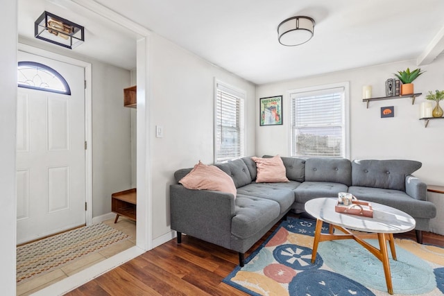 living area featuring wood finished floors and baseboards