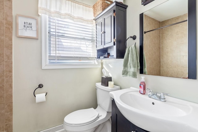 bathroom featuring toilet and vanity