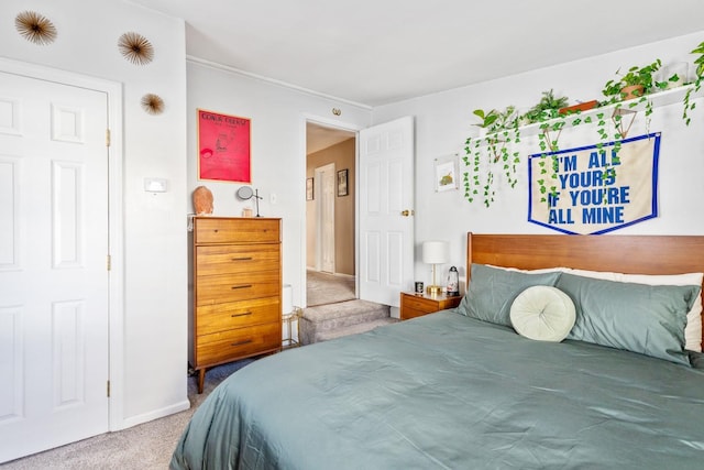 bedroom with carpet flooring and baseboards