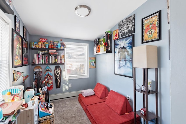 interior space featuring a baseboard heating unit, carpet, and baseboards