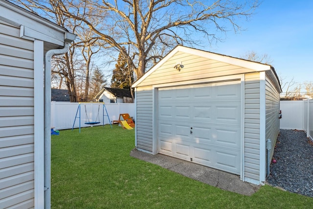 detached garage featuring fence