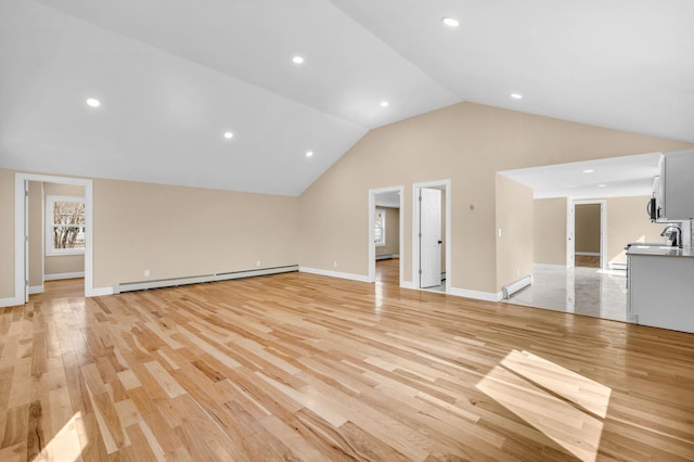 unfurnished living room featuring a baseboard radiator, lofted ceiling, baseboards, and light wood finished floors