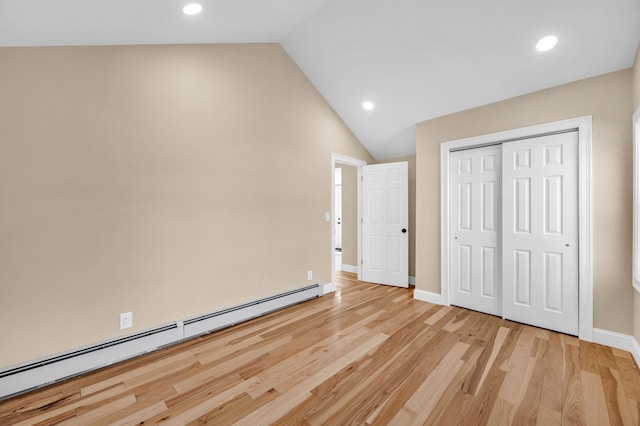 unfurnished bedroom featuring recessed lighting, a baseboard radiator, lofted ceiling, and light wood finished floors