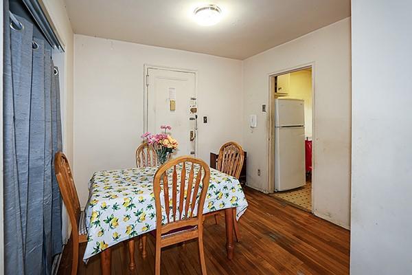 dining area with wood finished floors