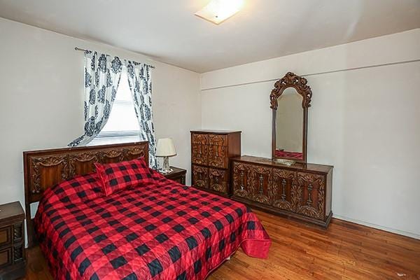 bedroom with wood finished floors