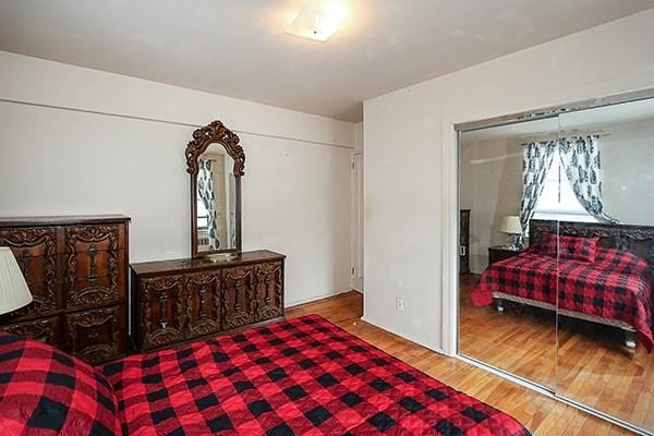 bedroom with wood finished floors