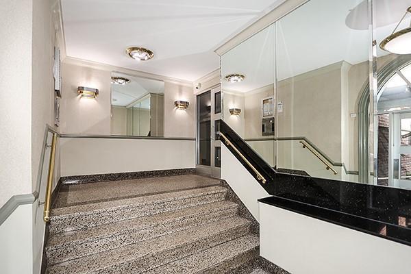 stairs with crown molding