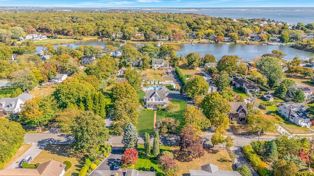 bird's eye view featuring a residential view, a view of trees, and a water view