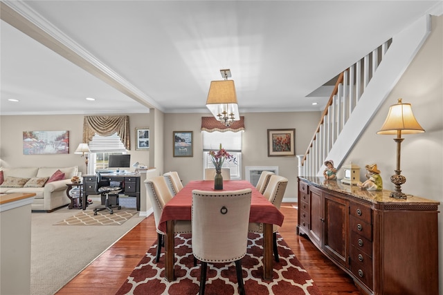 724 Thrush Ave, West Hempstead, NY 11552 - dining area featuring dark wood finished floors, a chandelier, crown molding, stairs, and recessed lighting