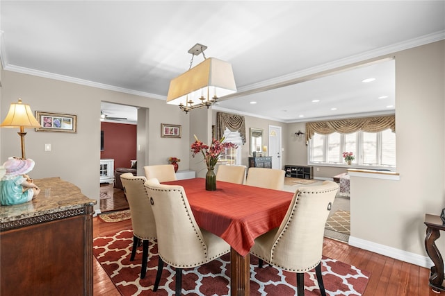 724 Thrush Ave, West Hempstead, NY 11552 - dining area featuring hardwood / wood-style flooring, baseboards, ornamental molding, recessed lighting, and a chandelier