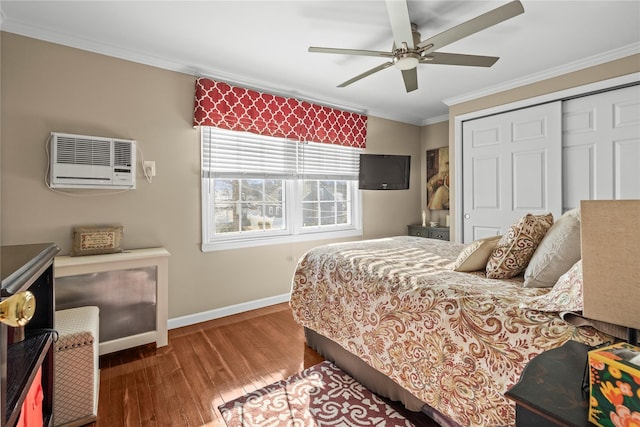 724 Thrush Ave, West Hempstead, NY 11552 - bedroom featuring baseboards, a wall mounted AC, ornamental molding, a closet, and wood finished floors