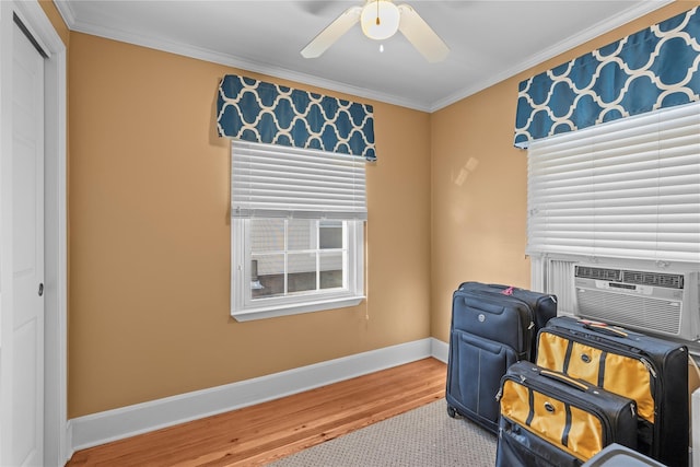 724 Thrush Ave, West Hempstead, NY 11552 - living area with wood finished floors, baseboards, a ceiling fan, and crown molding