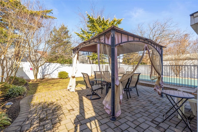 724 Thrush Ave, West Hempstead, NY 11552 - view of patio / terrace featuring a gazebo, outdoor dining space, a fenced backyard, and a pool