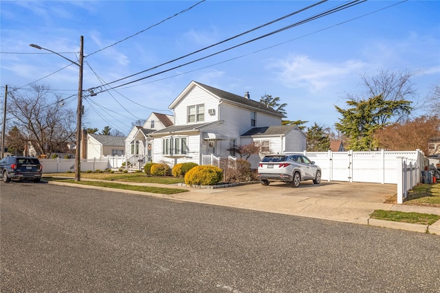 724 Thrush Ave, West Hempstead, NY 11552 - traditional-style home with a gate and fence