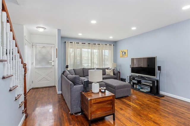 living area with recessed lighting, baseboards, stairs, and hardwood / wood-style flooring