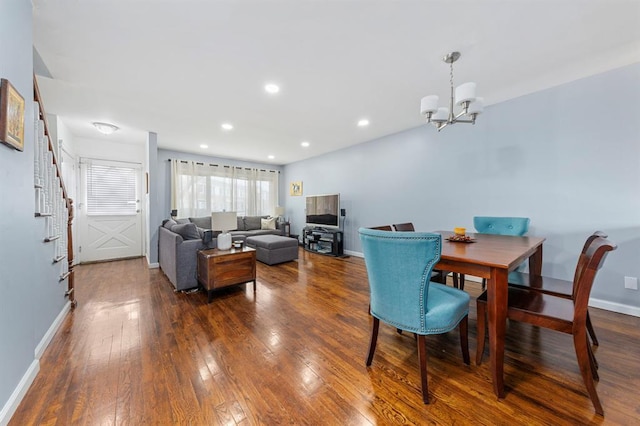 dining space with a notable chandelier, dark wood-type flooring, recessed lighting, baseboards, and stairs