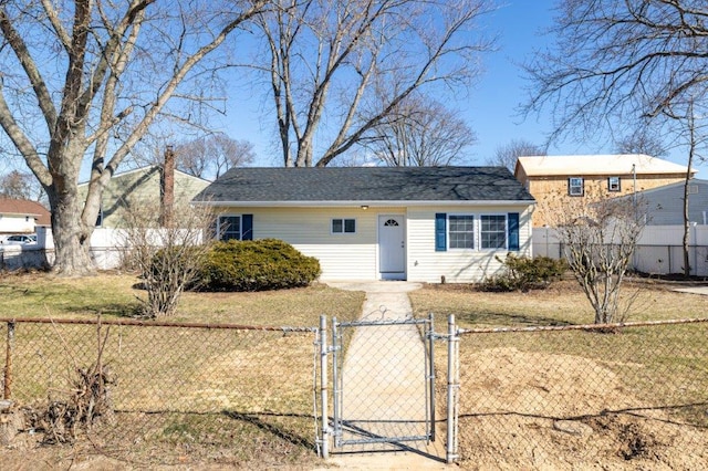 view of front facade featuring a front yard, a gate, and a fenced front yard