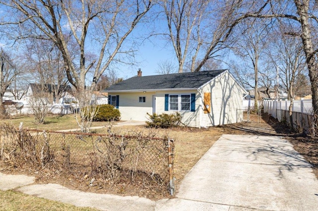 view of front of house with fence and a chimney