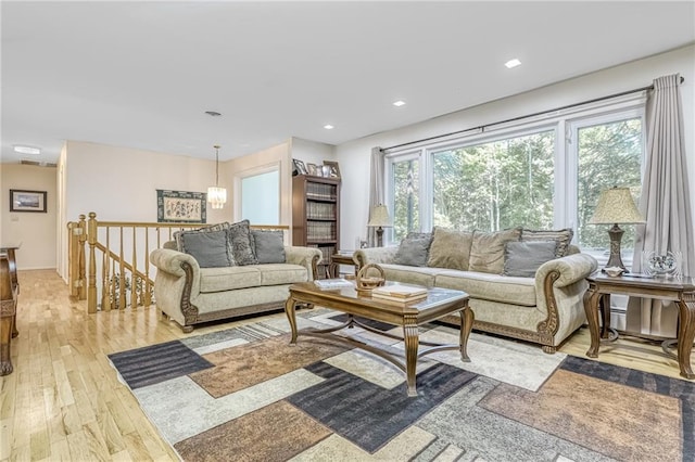 living room with recessed lighting and light wood-type flooring